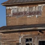 An old run down building with broken windows