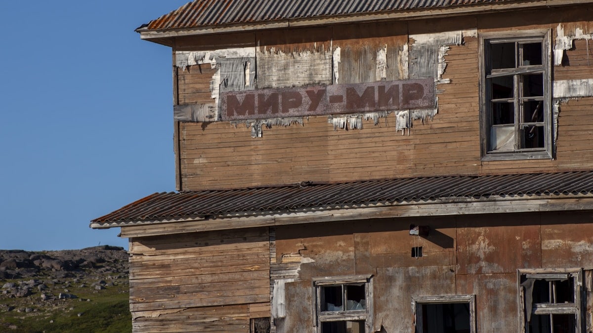 An old run down building with broken windows